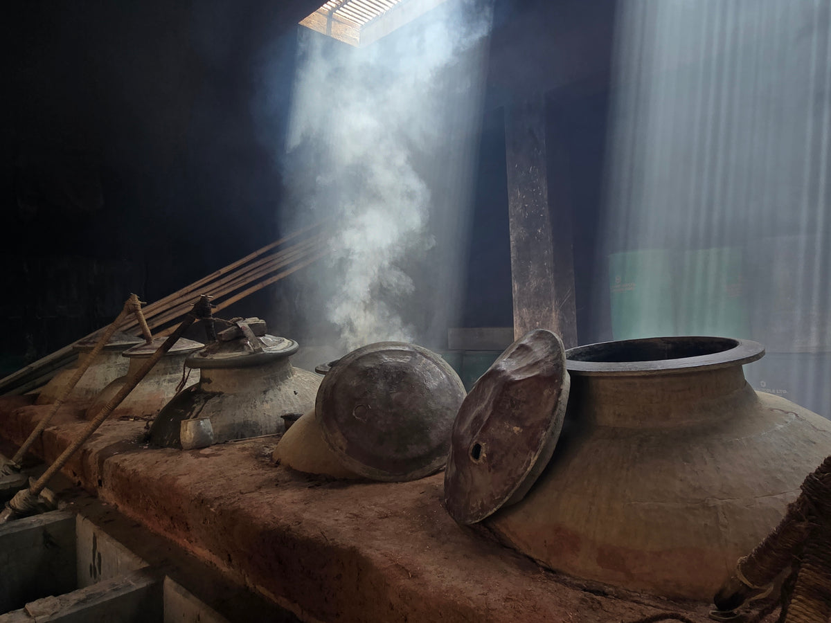 A documentary view of a copper deg and bhapka in the Kannauj workshop