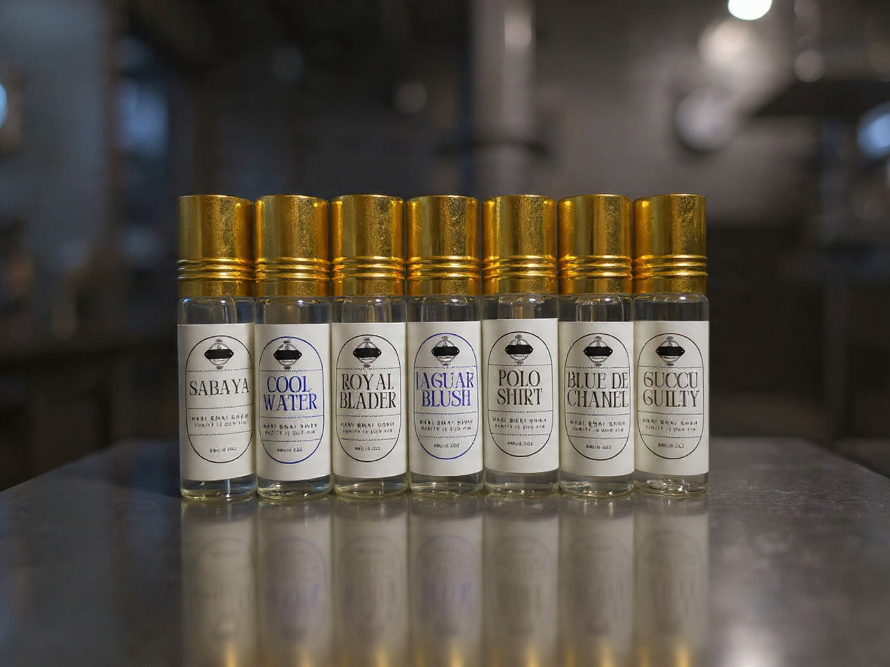 Seven perfume bottles with gold caps and white labels on a reflective surface, showcasing different fragrance names.