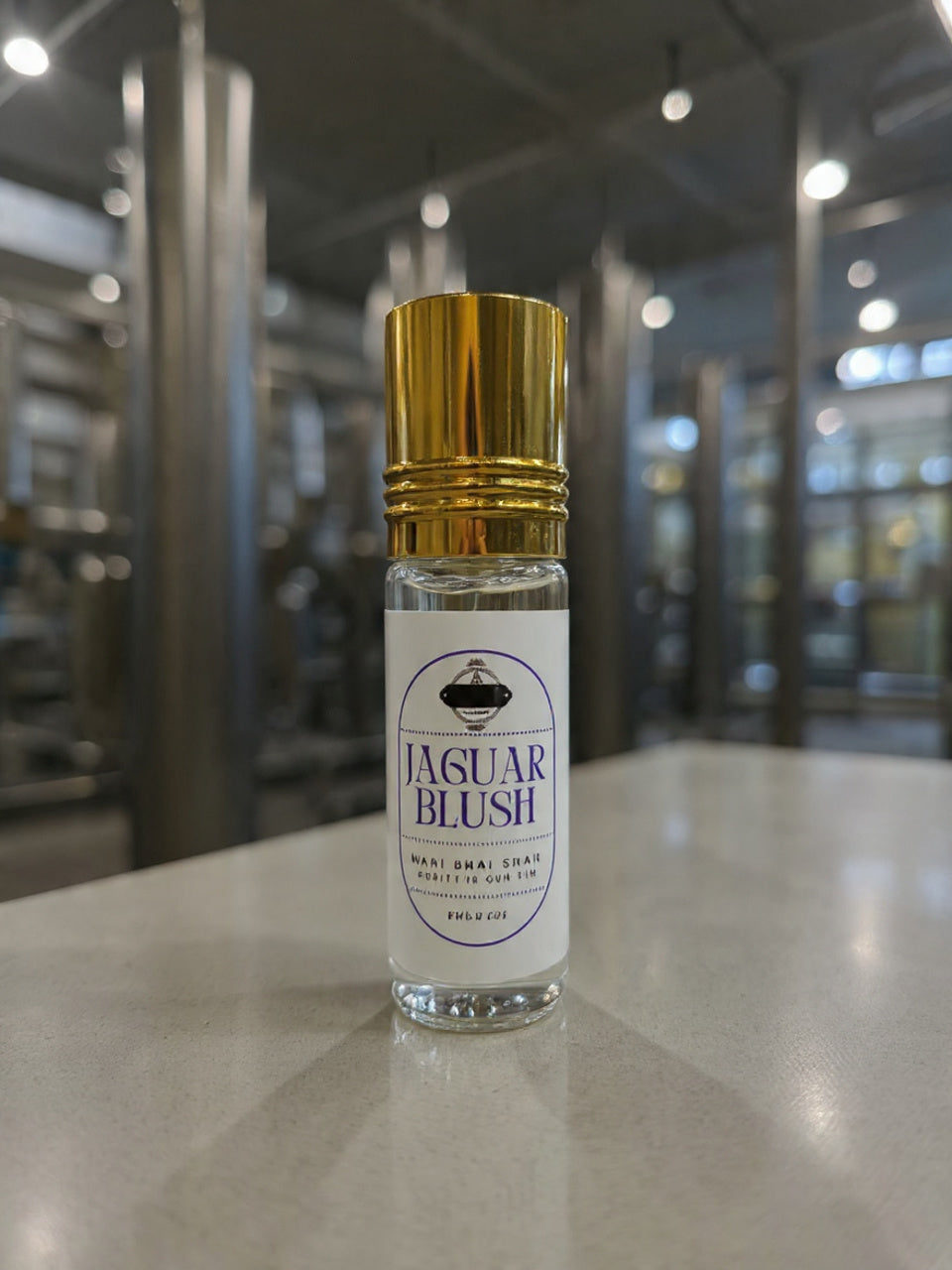 Small bottle of Jaguar Blush perfume on a reflective surface with a blurred background