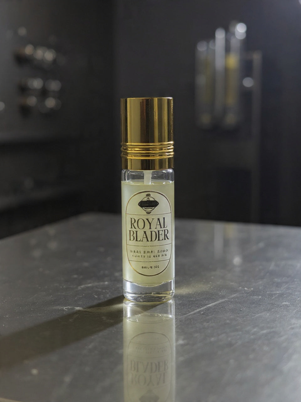 Roll-on bottle of Royal Blader perfume on a reflective surface with a dark background