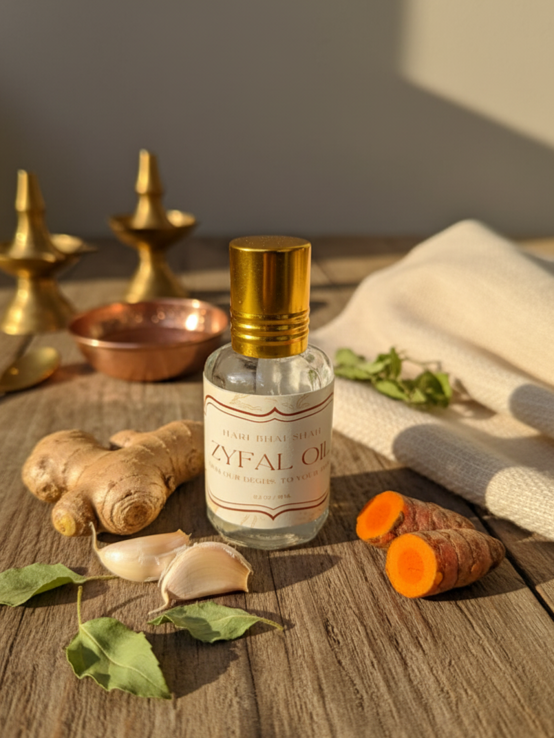 Bottle of Zyfal Oil on a wooden surface with ginger, garlic, and turmeric.